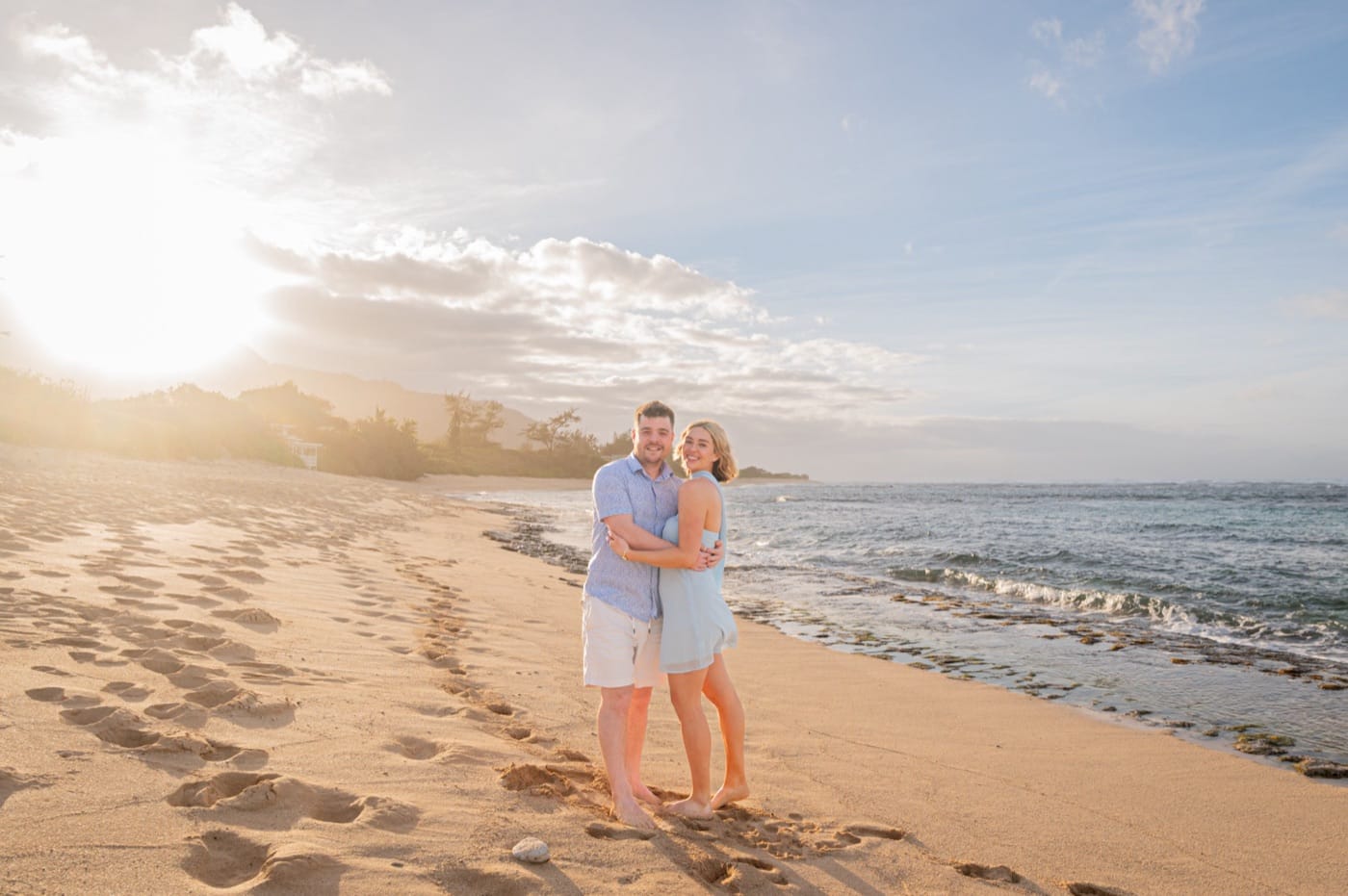 A couple on Mokuleia Beach at sunset